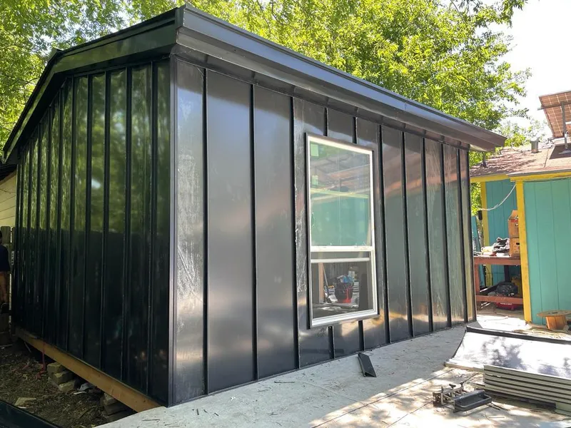 Black standing seam metal wall panels for Roof Inspection in Crozet