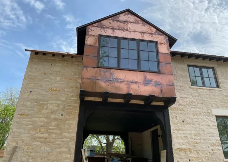 Copper metal panel facade on a stone building for Metal Roof Coating in Crozet
